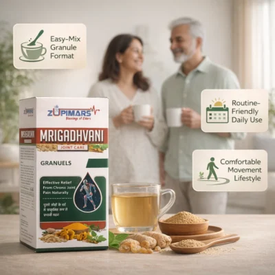 Zupimars Mrigadhvani Joint Care Granules being enjoyed by an elderly couple in their kitchen. This easy-mix granule format solves the common struggle of swallowing large, hard pills or dealing with messy oils. It targets morning joint stiffness and limited range of motion, providing a "Routine-Friendly Daily Use" solution for a "Comfortable Movement Lifestyle." The image shows the natural herbal ingredients like Turmeric and Boswellia alongside a glass of prepared herbal tea, addressing the need for natural relief from chronic knee and back pain.